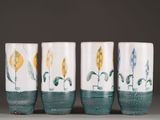 three vases with different designs on them on a table