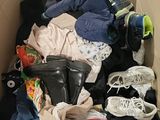a box full of clothes and shoes in it