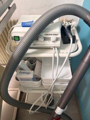 an image of a machine with a hose attached to it ' s side