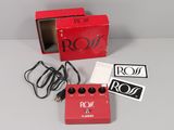 an image of a red box with a red pedal and a black and white sticker on it