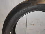 a close up of a tire on a white surface