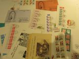 a table with a lot of postcards and stamps on it