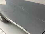 a close up of a car with a cracked door