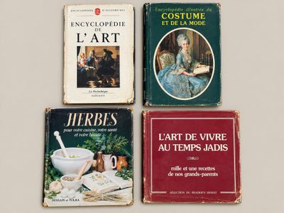 three books are sitting on a table next to each other