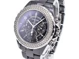 an image of a wrist watch with a black dial and a diamond bezel