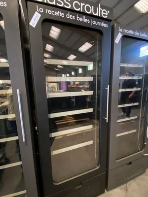 two glass doors that are open in a store