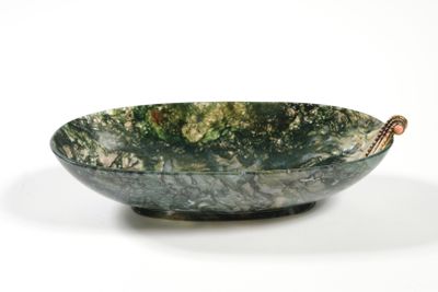 marble bowl on stand on white surface with white background