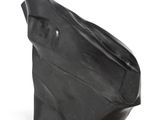 a close up of a black sculpture on a white surface