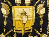 a black and gold scarf with a picture of a clock on it