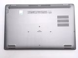 a laptop that is sitting on a white surface
