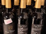 many bottles of wine sitting on a shelf in a store