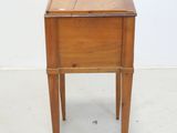 a small wooden table with a drawer on top of it