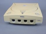 a white game console sitting on top of a table
