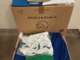 a box of clothes sitting on top of a carton