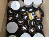 a cardboard box filled with many different types of jars