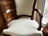 a chair that is sitting in front of a window