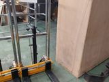 a picture of a fork lifter in a warehouse