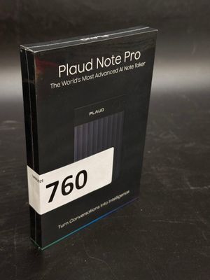 a close up of a book on a table with a black background