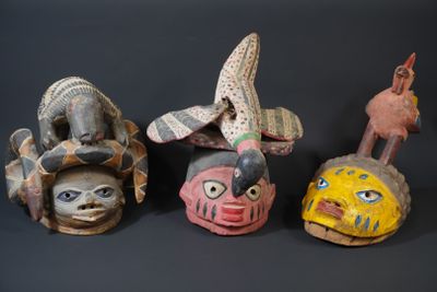 several different types of masks are displayed on a black surface