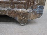 an old wooden trunk with a metal latch on it