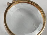 a close up of a magnifying glass on a white surface