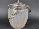an image of a vase with a lid on a table