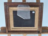 a picture of an easel with a chalk board on it