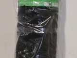 a roll of black yarn wrapped in plastic on a table