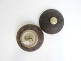 a small bowl and a small bowl sitting on a table