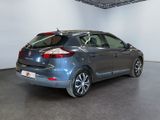 a picture of a grey car parked in a showroom