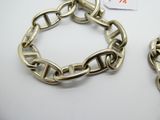 pair of silver plated chain bracelets with clasps and clasps