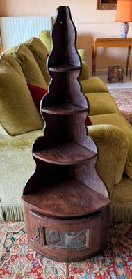 a tall wooden tower on a rug in a living room