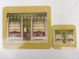 two coasters with a picture of a store front and a picture of a store front