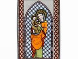 an image of a stained glass window with a woman holding a child