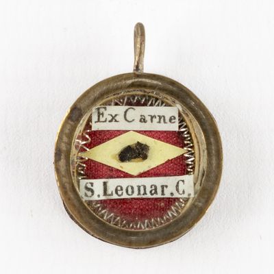 an image of a close up of a pendant on a white surface