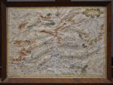 an old map of a mountain range in a wooden frame