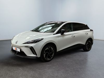 a white toyota c - hr is parked in a large room