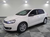 a picture of a white car parked in a garage