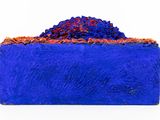 an image of a blue box with a pile of blue and red rocks