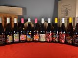 several bottles of wine are lined up on a table