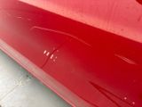 a close up of a red car that is painted red