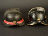 pair of fireman ' s helmet and helmet on a black background