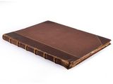 brown leather bound book on white background with copy space for text