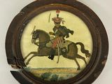 une photo d'une photo d'un homme sur un cheval