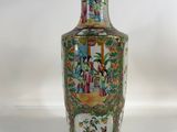 a vase that is sitting on a white surface