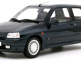 a small black car that is parked on a white surface