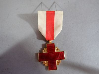 a red cross on a white ribbon with a red cross on it