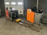 a fork lifter and a pallet in a garage