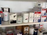 a shelf with many different types of medical supplies on it