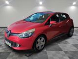a red car is parked in a room with a checkered floor